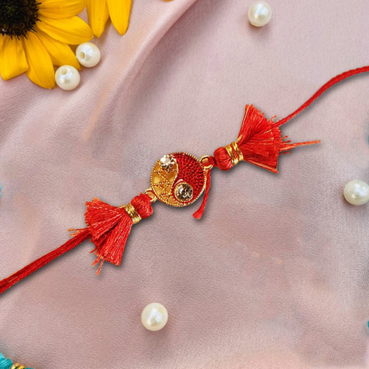 Red Rakhi With Pearls For The Occasion